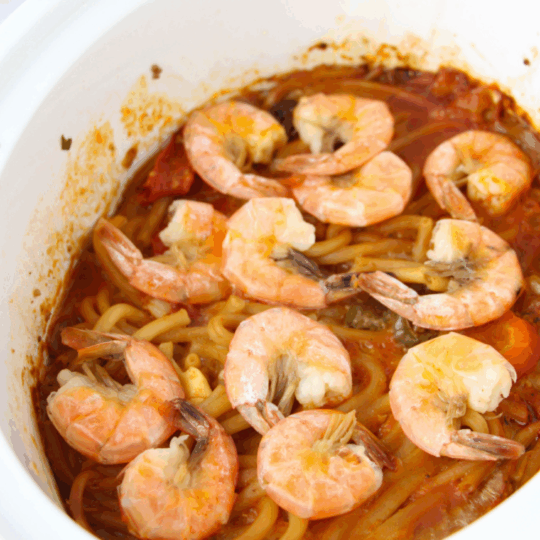 Close up of Cajun Jambalaya Pasta Recipe (Cheesecake Factory Copycat) in slow cooker.