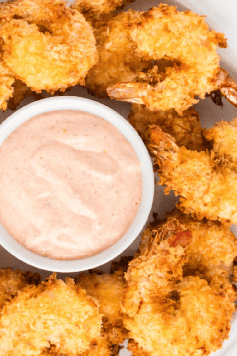 Crispy air fryer panko fried shrimp served hot with lemon wedges and cocktail sauce