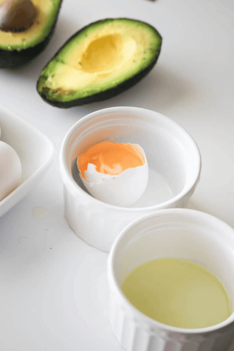 Mixing a delicious stuffing for the avocado, featuring ingredients like beans, cheese, and spices.