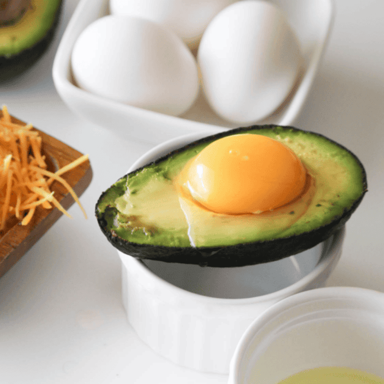 Mixing a delicious stuffing for the avocado, featuring ingredients like beans, cheese, and spices.