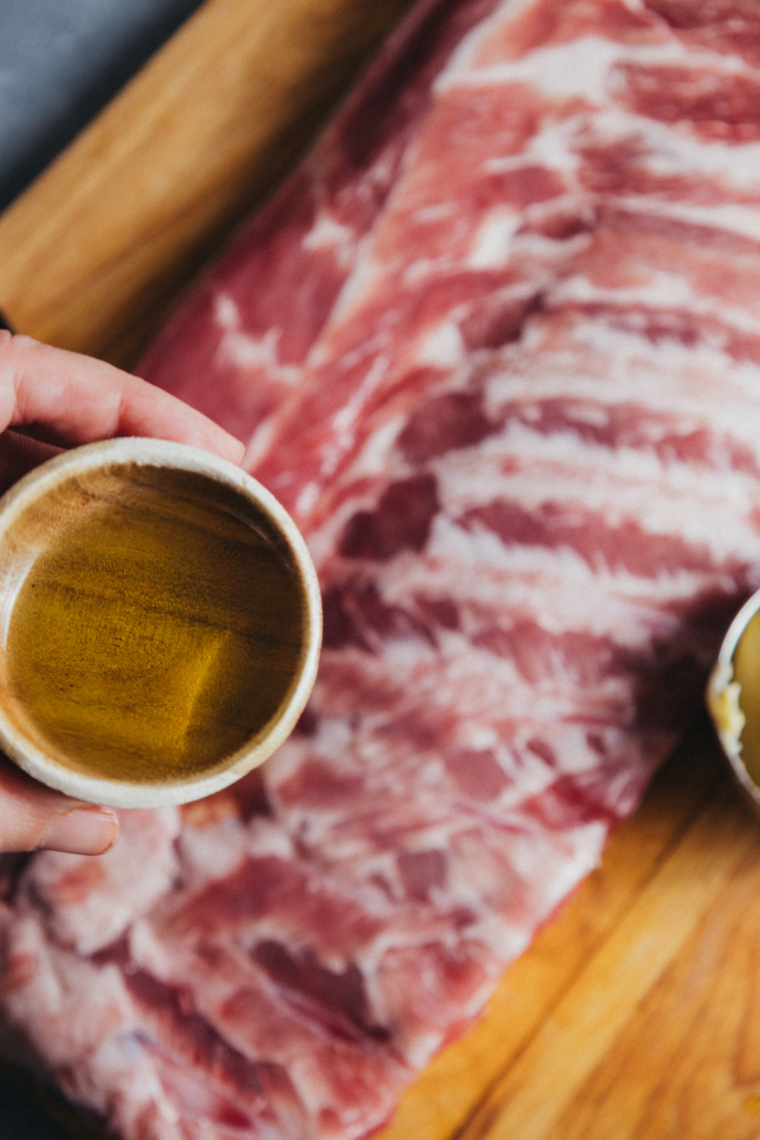 Ribs cut into sections and tightly wrapped in foil to lock in steam and make them tender before cooking