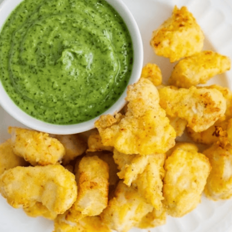 creamy avocado lime ranch dressing served in bowl with fresh herbs