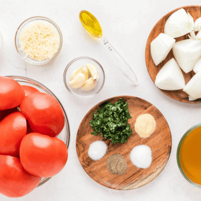 Ingredients needed for Easy Air Fryer Tomato Soup on kitchen table.