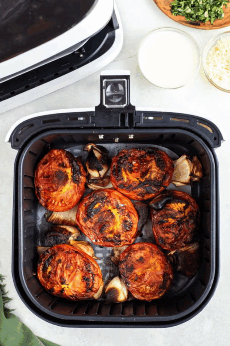 Roasted vegetables in the air fryer basket.