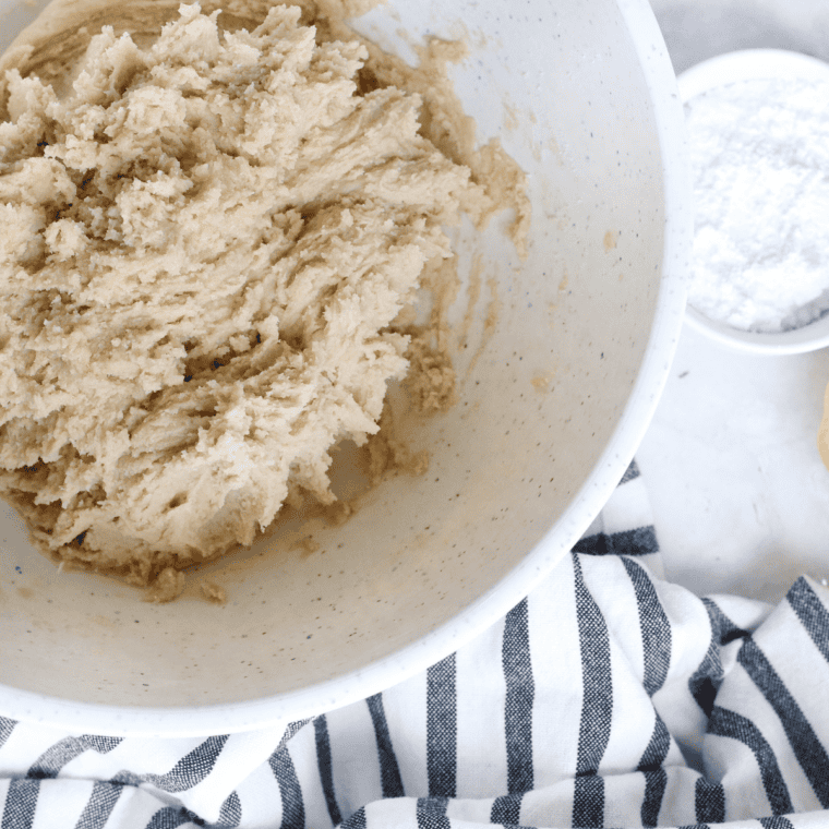 Cake mix, eggs, and vegetable oil combined in a large bowl to form smooth cookie dough