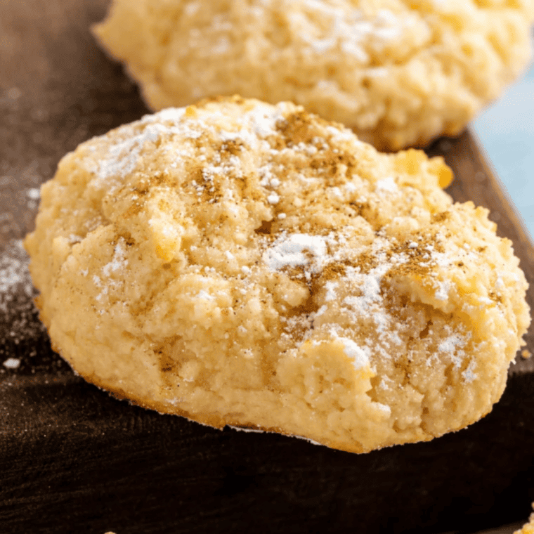 Golden keto cream cheese cookies cooling on a wire rack after air frying, ready to enjoy.