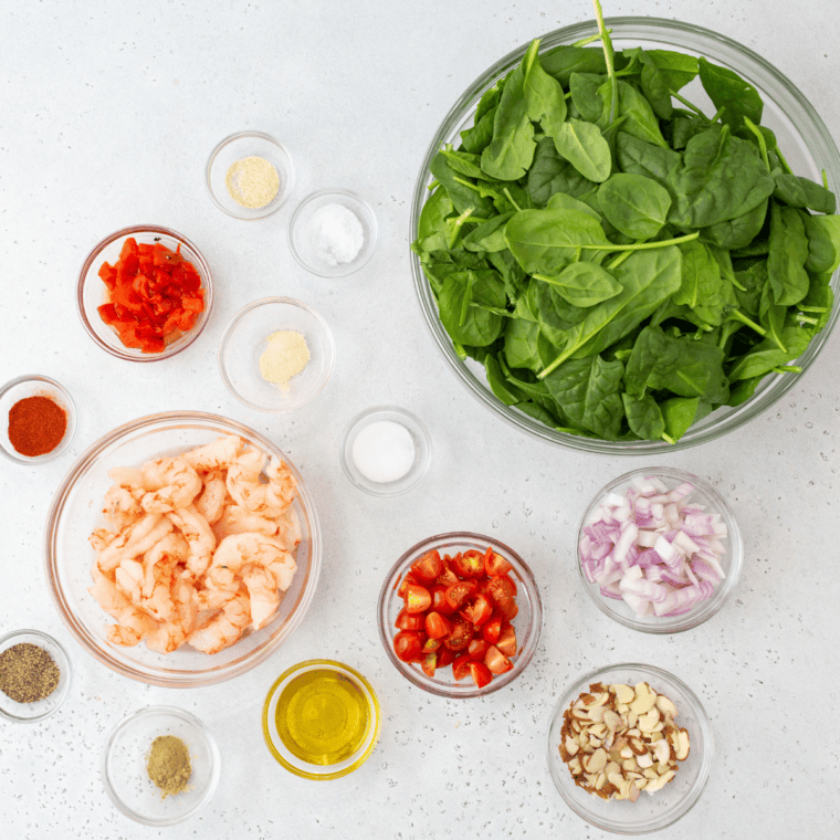 ingredients needed for Applebee's Grilled Shrimp N' Spinach Salad With Bacon Vinaigrette Ingredients on kitchen table.