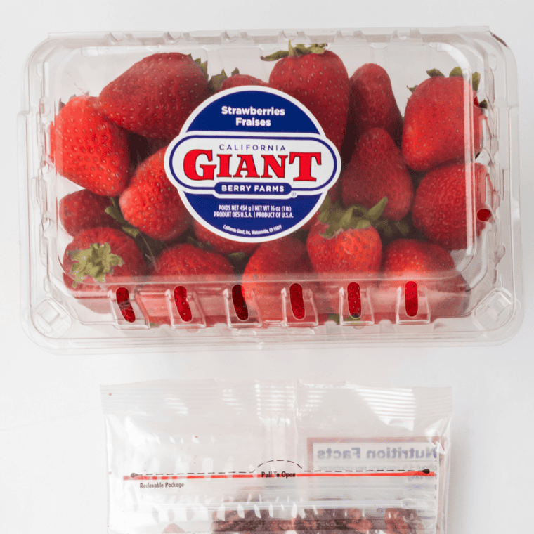 Whole fresh strawberries arranged on a table before making strawberry candy