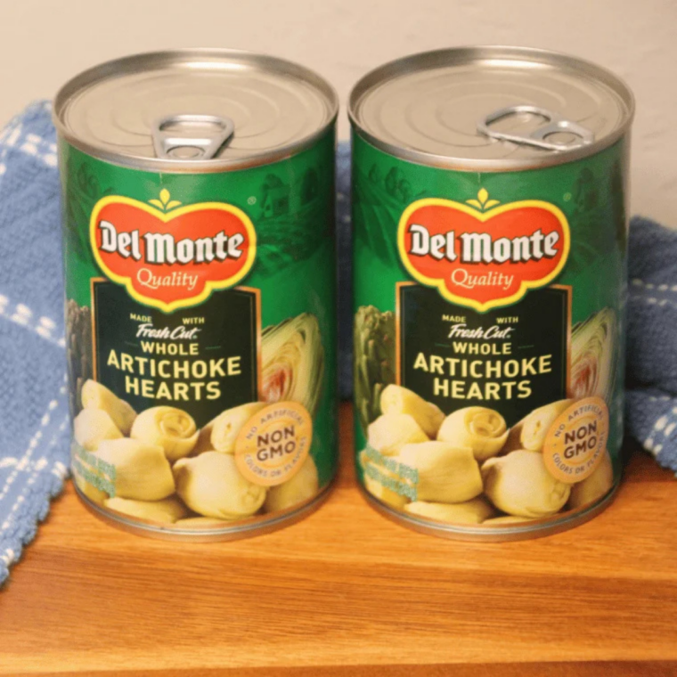 Ingredients for air fried canned artichokes: a can of artichoke hearts, olive oil, and seasoning