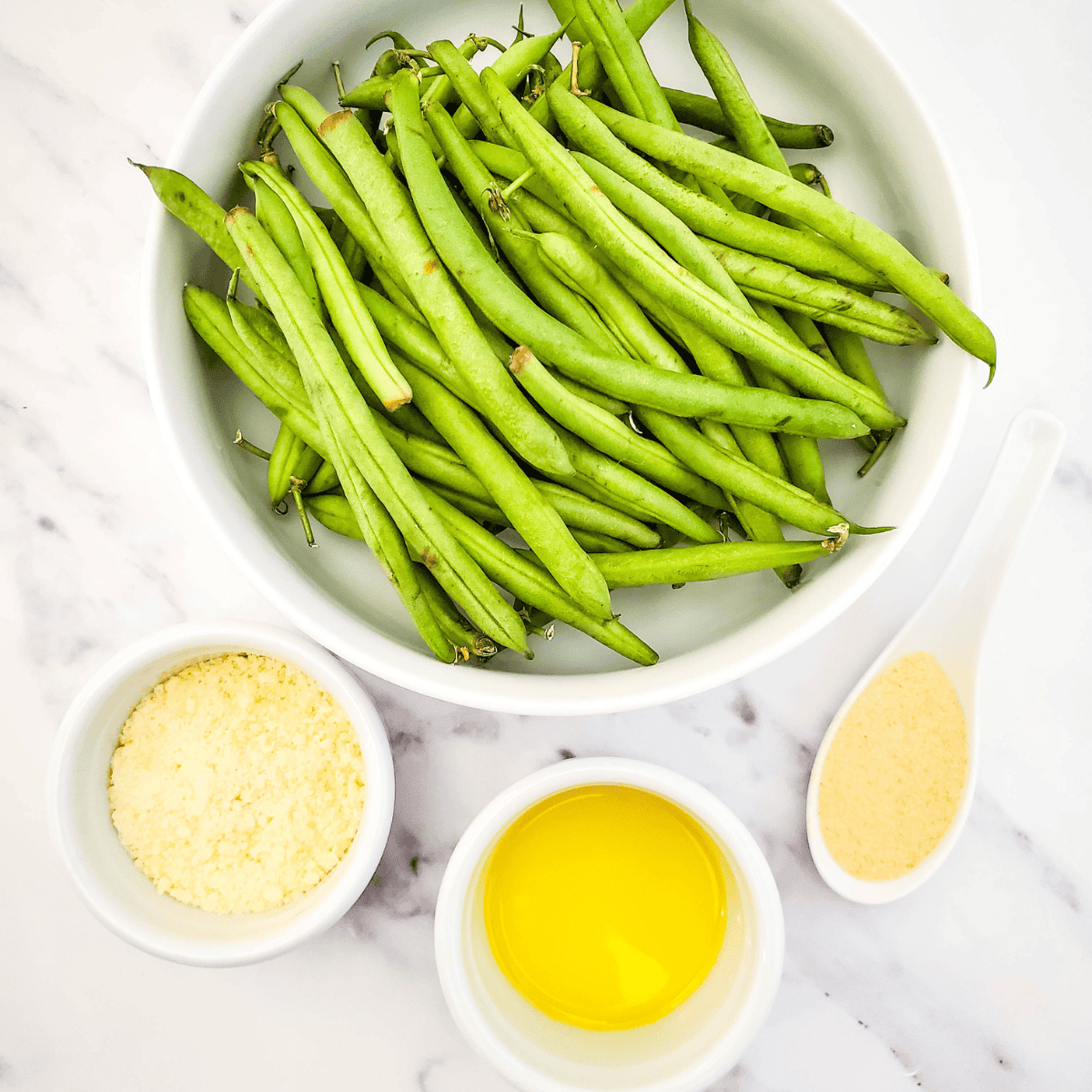 Ingredients needed for Bojangles Green Beans Recipe on kitchen table.