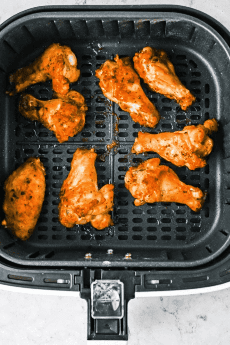 Crispy chicken wings coated in homemade Wingstop Louisiana rub on a plate