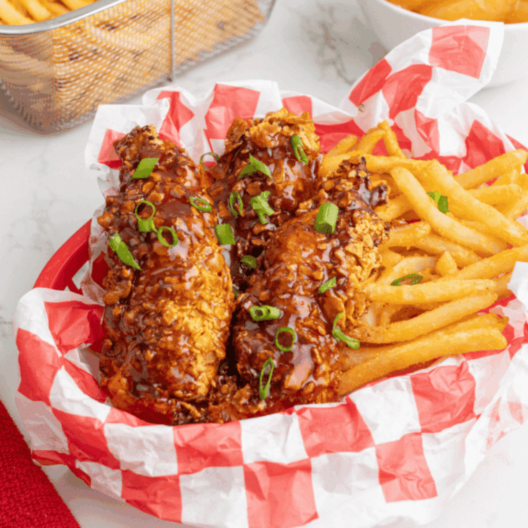Plate of Copycat Dairy Queen Honey BBQ Chicken Strips Recipe with french fries.