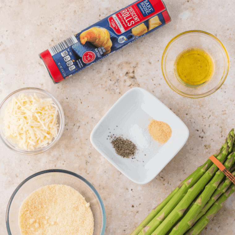 Ingredients needed for Easy Air Fryer Asparagus Crescent Rolls on kitchen table.