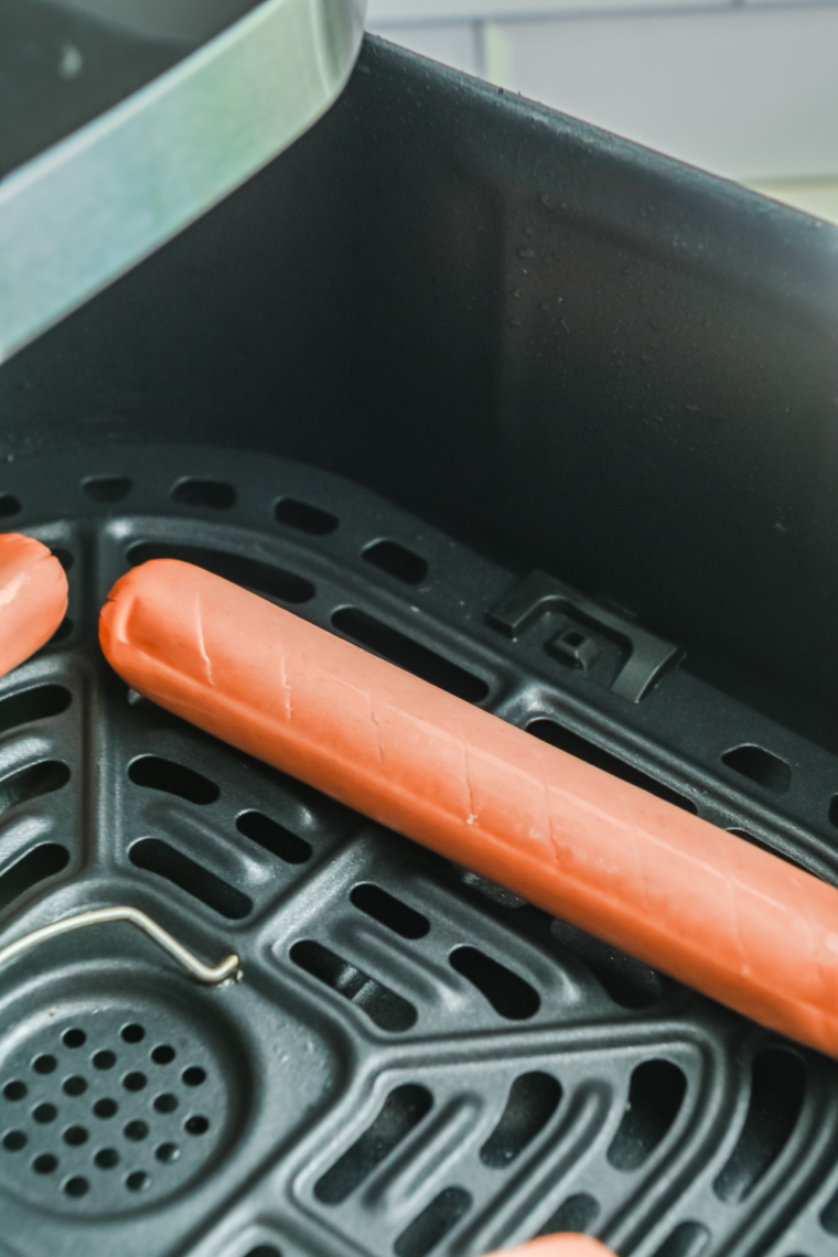 Air fryer preheated to 390&deg;F creates lightly crisped, juicy hot dogs.