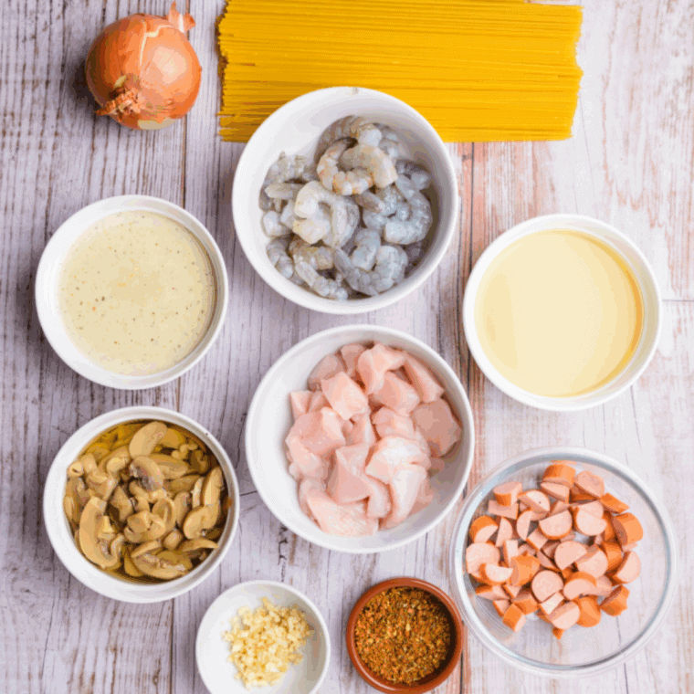 Ingredients needed for Copycat Red Lobster Cajun Chicken Linguini Alfredo Recipe on kitchen table.
