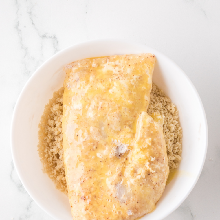 Fish fillets sprinkled with paprika, lemon pepper, parsley and breadcrumbs before baking