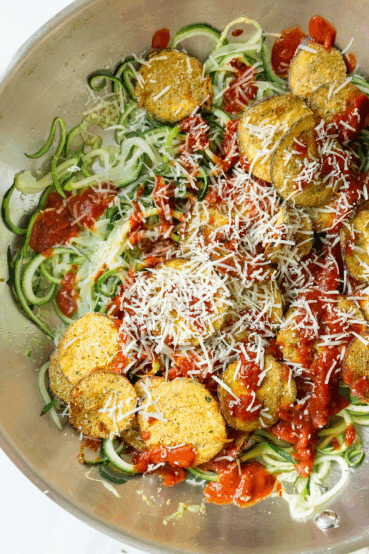 Crispy golden air fryer eggplant chips served in a bowl, ready to eat.