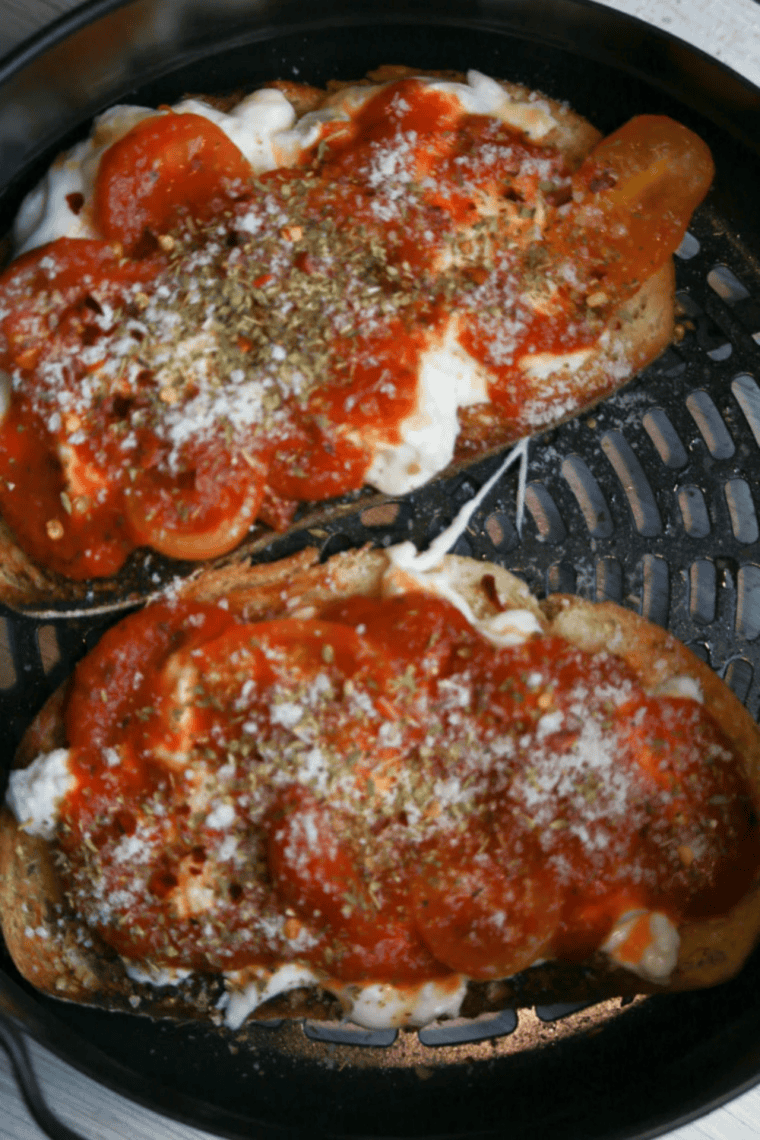 Crispy air fryer pizza topped with melted burrata, cherry tomatoes, Parmesan, and fresh herbs