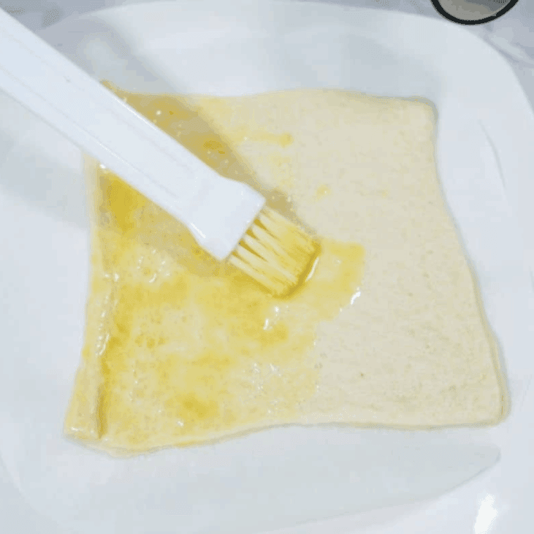 Brush the dough with melted butter.