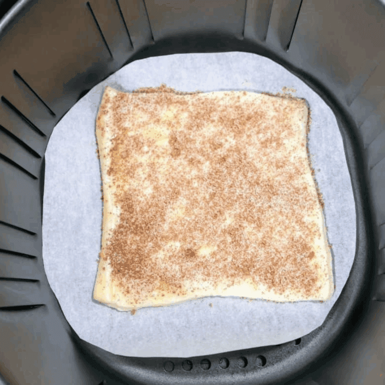 Place the cinnamon coated bread into the air fryer basket.