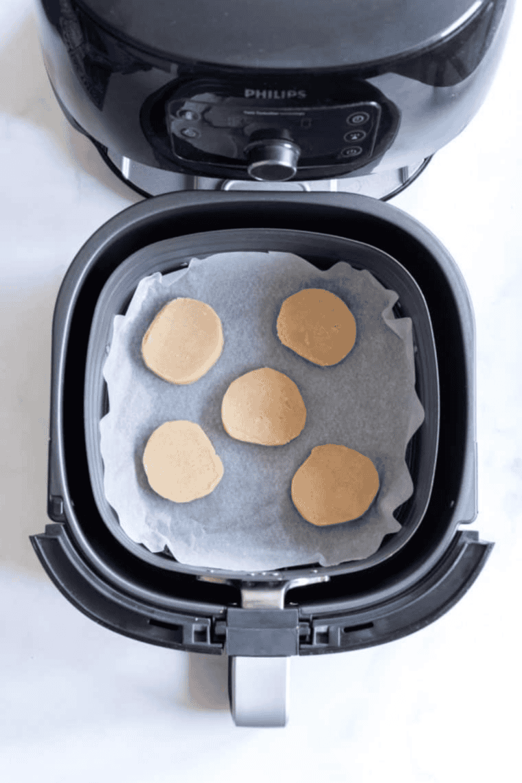 Place the cookie dough on top of the parchment paper.