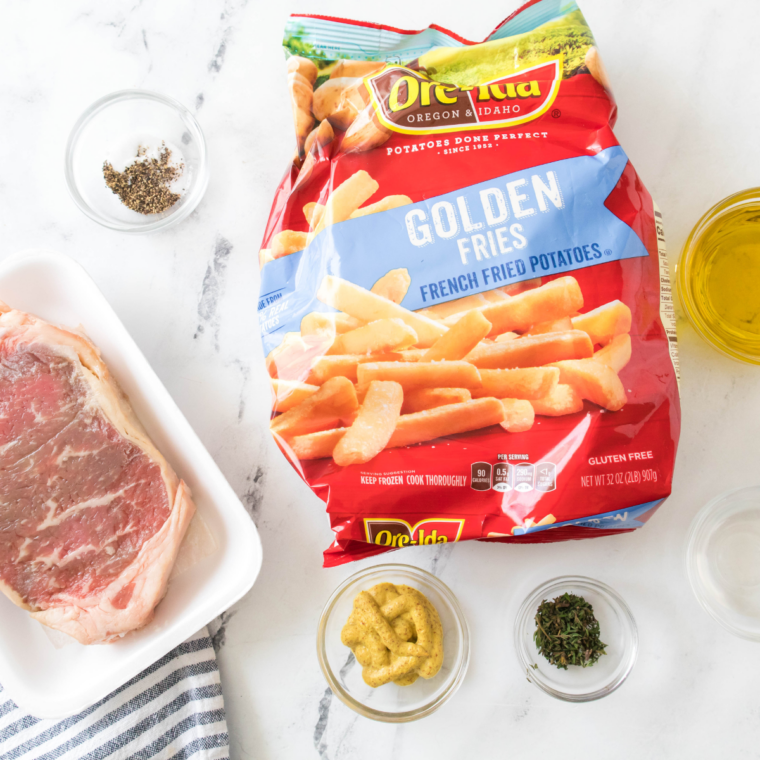 Ingredients needed for Air Fryer Steak Frites on kitchen table.