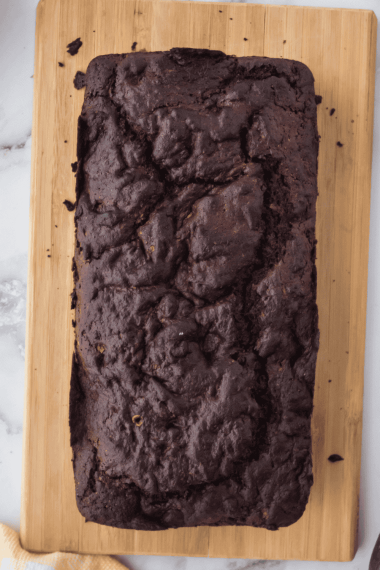 Golden air fryer chocolate chip zucchini bread fresh from the basket, sliced and ready to serve.