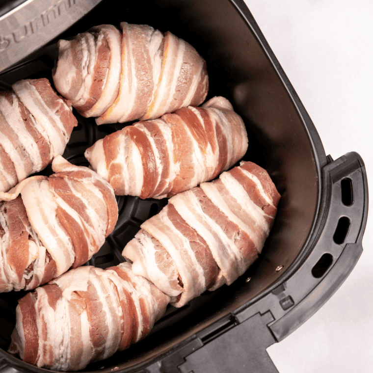 Crispy Air Fryer Armadillo Eggs with melted cheese inside, served on a plate.