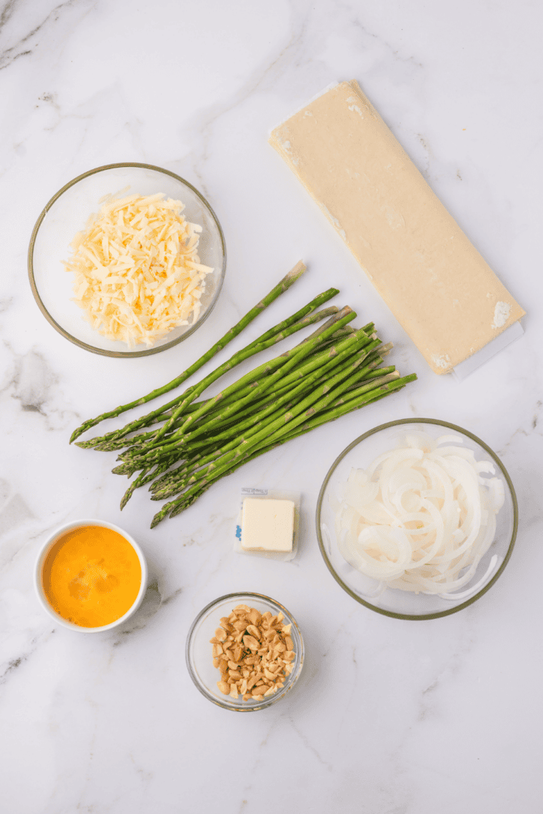 Ingredients needed for Easy Air Fryer Asparagus Tart on kitchen table.