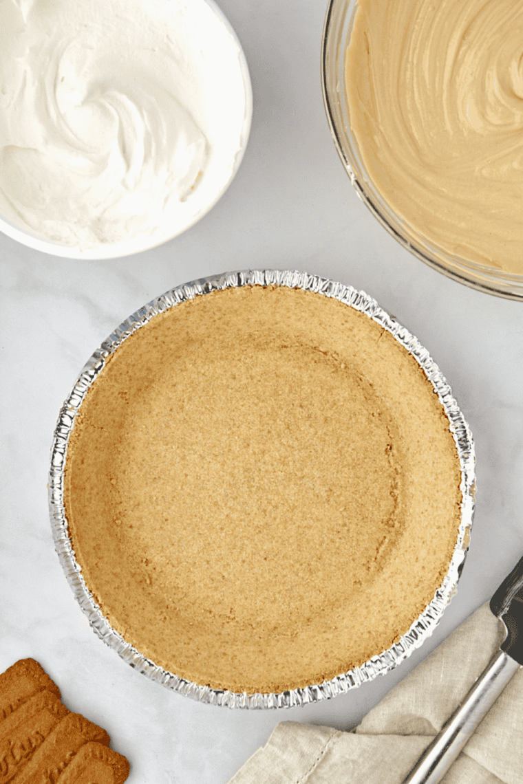 sweetened condensed milk being mixed into cream cheese until smooth and silky