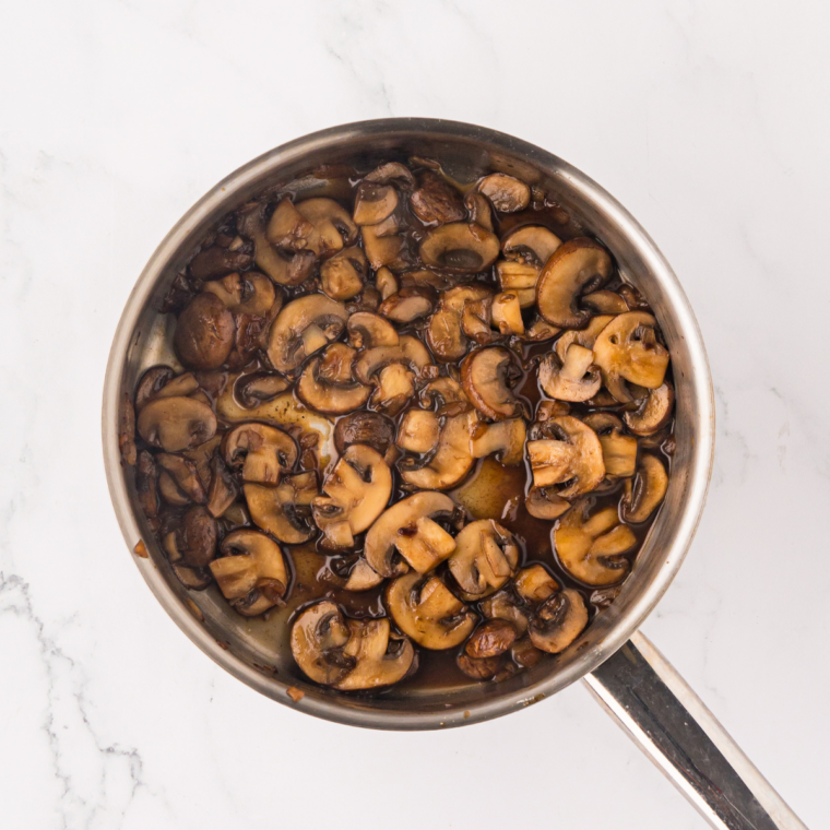 Browning mushrooms over medium heat for rich savory sauce base