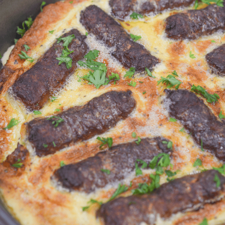 Air fryer toad in the hole with golden batter and sausages in a crisp Yorkshire pudding