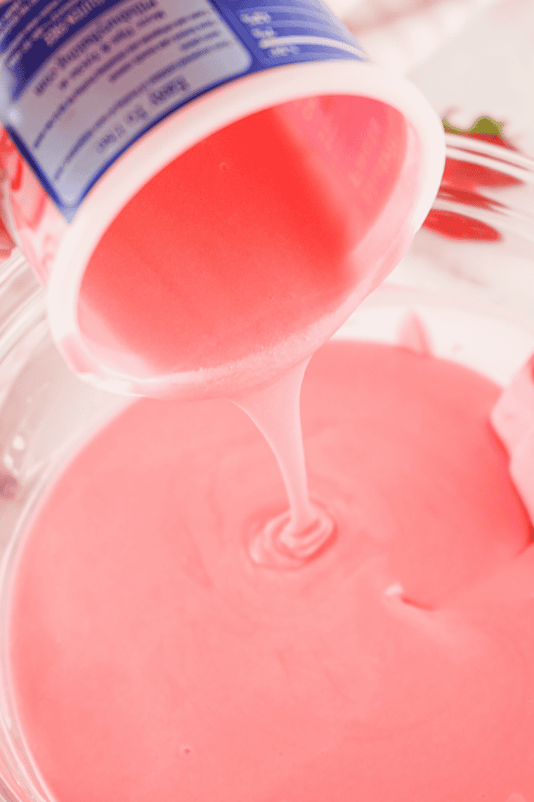 Strawberry frosting stirred into melted pink candy melts to make fudge.