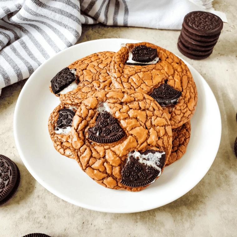 Freshly baked Oreo brownie cookies cooling on a wire rack