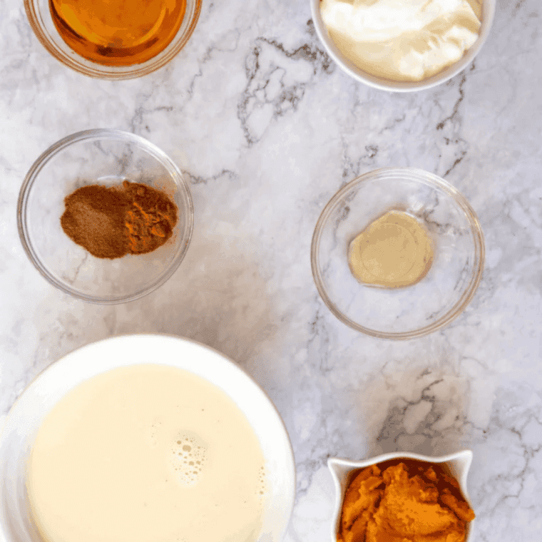 Ingredients for Ninja Creami Jack in the Box Pumpkin Pie Shake including pumpkin puree, milk, cream, sugar, and spices
