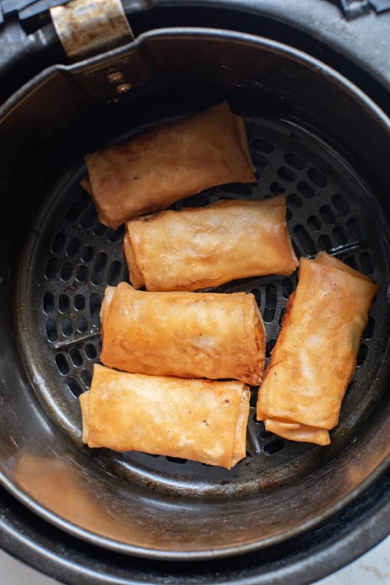 I started wrapping things in egg roll wrappers a few years ago and honestly, I haven't stopped since. What began as a classic pork-and-cabbage situation quickly turned into a full obsession — because once you realize that an egg roll wrapper is basically a blank canvas for anything in your fridge, the possibilities get really fun, really fast. The air fryer is what makes all of this work. A quick spritz of oil and ten minutes at high heat gives you that loud, shatteringly crisp crunch without a pot of oil on the stove, without the smell that lingers for two days, and without the mess. I've rolled leftover mac and cheese, a full Reuben sandwich, a loaded baked potato, and even peanut butter and banana into these little wrappers — and every single one has been a hit. Whether you're looking for a game-day appetizer, a drive-thru copycat, or a creative way to use up leftovers, these 15 recipes are the ones I make on repeat.
1. Air Fryer Egg Rolls (Homemade or Frozen)
Air Fryer Egg Rolls (Homemade or Frozen)
This is the one I send to everyone who's just getting started. It covers both a homemade ground beef and vegetable filling rolled from scratch and the exact time and temperature for cooking frozen egg rolls straight from the box — shatteringly crisp either way, with just a tablespoon of oil.
View Recipe →
2. Copycat Jack in The Box Egg Rolls
Copycat Jack in The Box Egg Rolls
Everything you love about those savory drive-thru egg rolls, made right at home with seasoned pork, cabbage, and veggies — and honestly, crispier than the original. Perfect for dipping, perfect for a crowd, and so much better than the drive-thru line.
View Recipe →
3. Crispy Air Fryer Chicken Cilantro Egg Rolls
Crispy Air Fryer Chicken Cilantro Egg Rolls
These taste like they took real effort, but they really didn't. The move here is a handful of dried cranberries in the filling — that little hit of sweetness balances the jalapeño and fresh cilantro in a way that sounds unexpected but absolutely works.
View Recipe →
4. Air Fryer Egg Roll In A Bowl
Air Fryer Egg Roll In A Bowl
When I want all that savory, ginger-garlic, umami-rich egg roll flavor but want to skip the wrapper entirely, this deconstructed version is my go-to. It comes together in minutes and is every bit as satisfying as the real thing.
View Recipe →
5. Air Fryer Reuben Egg Rolls
Air Fryer Reuben Egg Rolls
Salty corned beef, melty Swiss, and tangy sauerkraut wrapped in a shell that shatters when you bite it — no deep fryer, no pot of oil, twenty minutes start to finish. These disappear faster than anything else I put out at a party.
View Recipe →
6. Air Fryer Mac And Cheese Egg Rolls
Air Fryer Mac And Cheese Egg Rolls
One of my favorite ways to repurpose leftovers — when my kids can't finish a pan of mac and cheese, I stuff it into egg roll wrappers and let the air fryer do the rest. Creamy and soft on the inside, perfectly golden and crunchy on the outside.
View Recipe →
7. Air Fryer Peanut Butter Banana Egg Rolls
Air Fryer Peanut Butter Banana Egg Rolls
Three ingredients, fifteen minutes, and you've got a warm, gooey dessert roll that feels way more indulgent than it has any right to. The peanut butter gets melty, the banana softens up, and it's my go-to when I need something sweet after dinner.
View Recipe →
8. Air Fryer Antipasto Egg Rolls
Air Fryer Antipasto Egg Rolls
I took everything I'd put on an Italian antipasto platter — deli ham, pepperoni, provolone, mozzarella, pepperoncini — and wrapped it up. Ten minutes at 400°F gives you a shatteringly crisp shell around a molten, salty, tangy center. Dip them in Italian dressing and thank me later.
View Recipe →
9. Air Fryer Jalapeno Popper Egg Rolls
Air Fryer Jalapeno Popper Egg Rolls
Everything good about a classic jalapeño popper — hot cream cheese, sharp cheddar, smoky bacon, real jalapeño heat — wrapped in a shell that the air fryer gets perfectly crisp in 8 to 10 minutes. No pot of oil, no fuss, just serious crunch.
View Recipe →
10. Air Fryer Loaded Mashed Potato Egg Rolls
Air Fryer Loaded Mashed Potato Egg Rolls
Leftover mashed potatoes stuffed with cheese and bacon, wrapped up and air-fried until golden — served with a side of sour cream, these taste exactly like a loaded baked potato with the best crunchy exterior you've ever had.
View Recipe →
11. Air Fryer Cheesecake Egg Rolls
Air Fryer Cheesecake Egg Rolls
The air fryer isn't just for savory recipes! The high heat crisps the wrapper beautifully while keeping the rich, creamy cheesecake filling warm and gooey on the inside. A drizzle of chocolate sauce or a handful of fresh berries on top and these will absolutely wow your guests.
View Recipe →