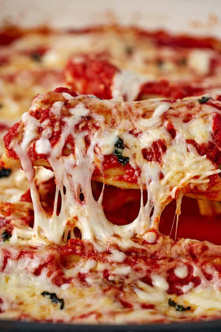 Easy air fryer manicotti stuffed with cheesy ricotta filling and topped with marinara and melted mozzarella