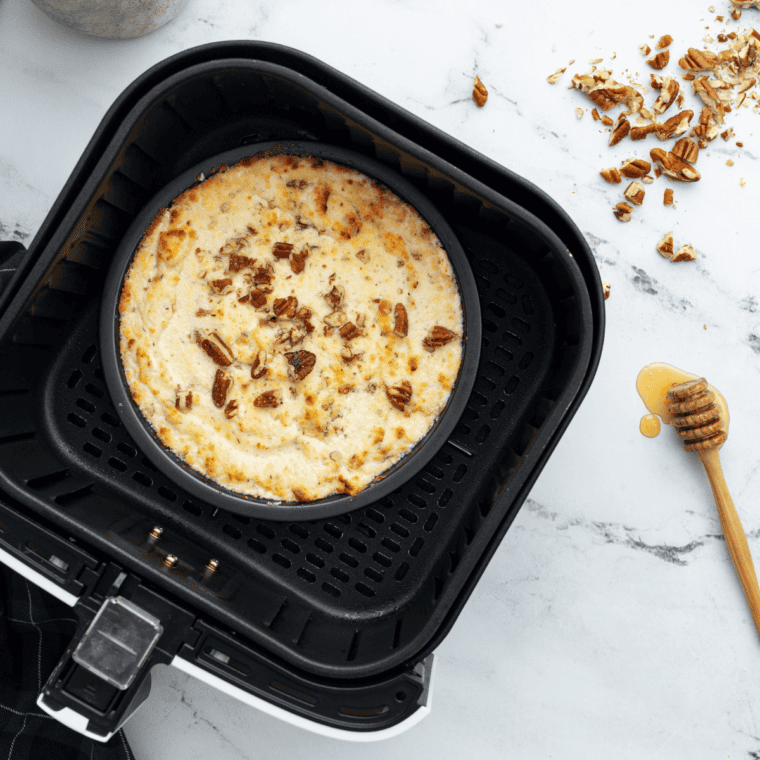 Golden, bubbling baked goat cheese dip fresh out of the air fryer