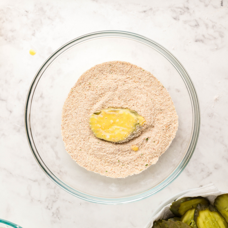 Bowl of finely crushed panko breadcrumbs for a crispy fried pickle coating