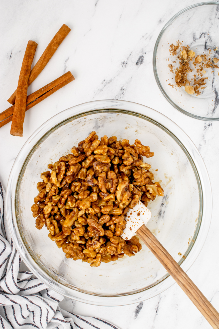 Small bowl of granulated sugar, brown sugar, cinnamon, and salt stirred together for candied nuts