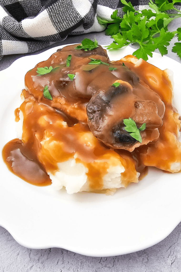 Plate of creamy copycat Culver's mashed potatoes smothered in rich brown gravy