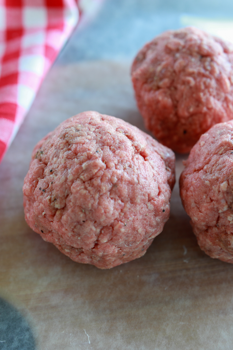 Ground beef portioned into loose 2-ounce balls for smash burgers