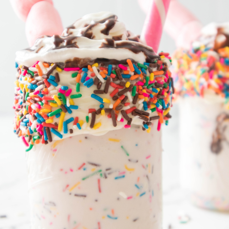 Close-up of a copycat Steak and Shake birthday cake shake with cake chunks and colorful sprinkles
