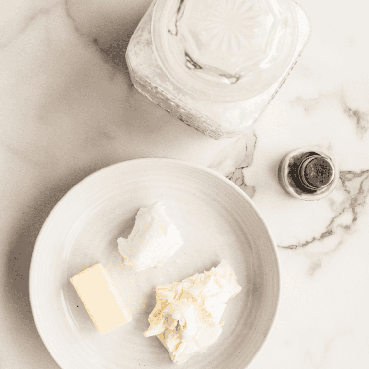 Creaming butter, granulated sugar and brown sugar in a mixing bowl until light and fluffy