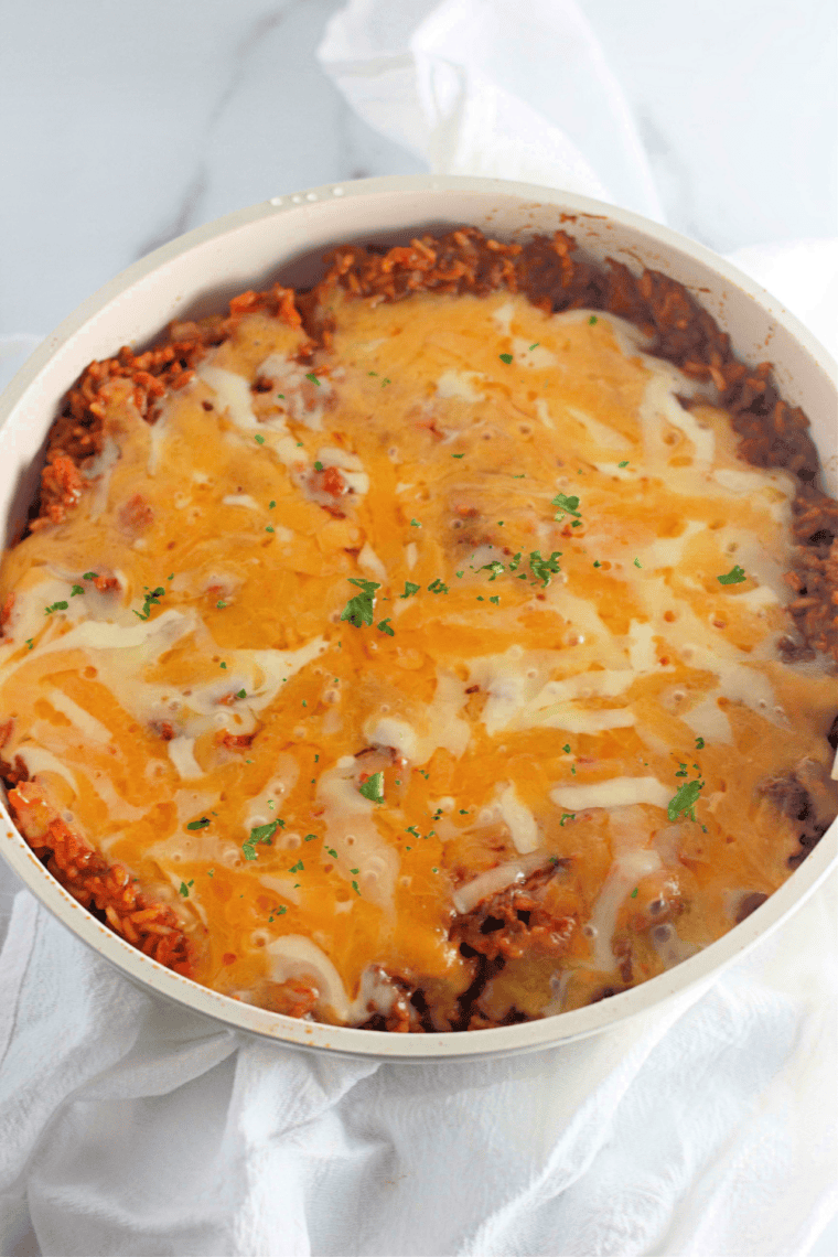 Easy one-pan taco rice skillet with ground beef, Rotel, and melted cheese