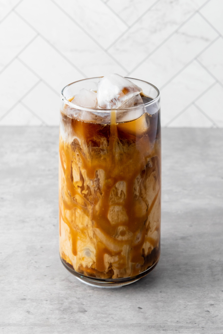 Homemade Buc-ee's coffee copycat recipe with layered iced coffee, caramel drizzle, and text overlay