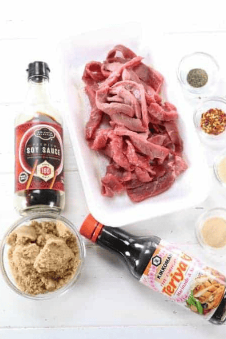 Ingredients for copycat Buc-ee's beef jerky including eye of round, soy sauce, brown sugar, and garlic