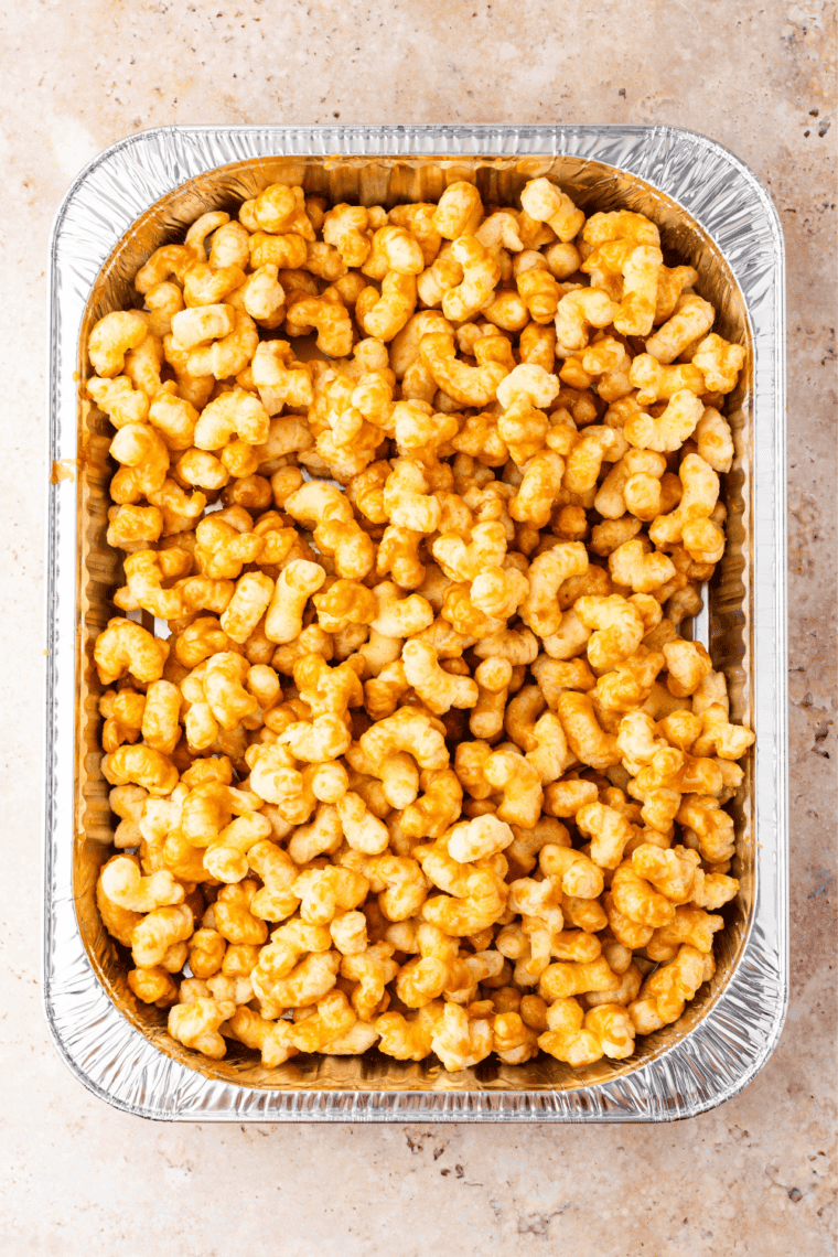 Puffed corn in a large bowl for copycat Beaver Nuggets