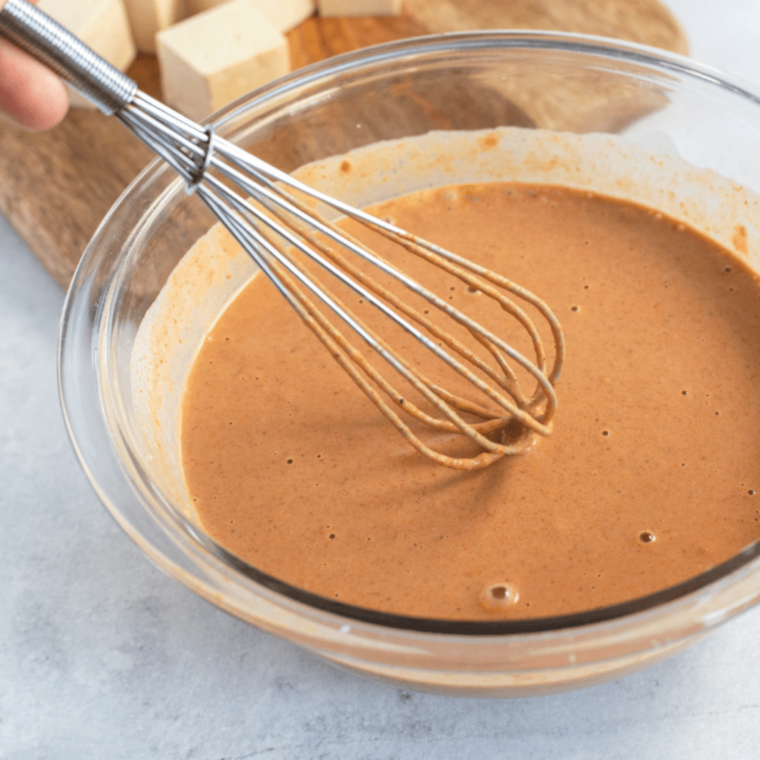 Curry yogurt tandoori-style tofu marinade on grilled tofu skewers with charred golden edges and fresh cilantro