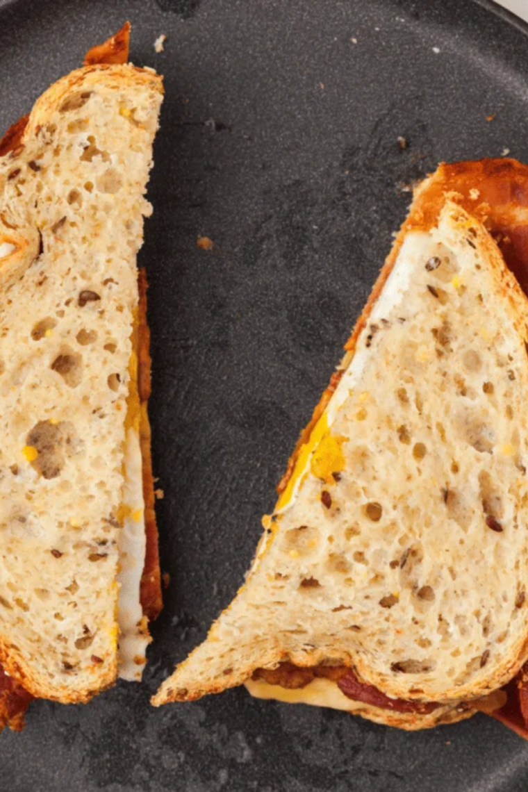 Candied bacon sandwich with crispy brown sugar bacon, lettuce, and tomato on toasted bread